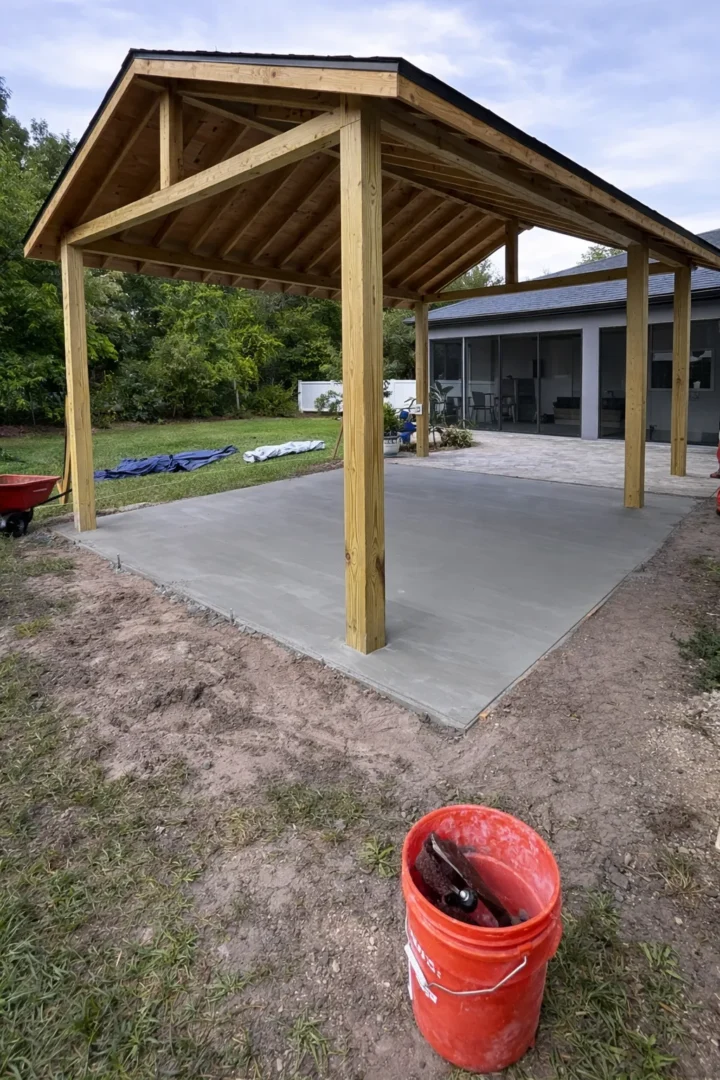 Stamped concrete floor installation with decorative stone pattern for indoor patio